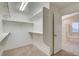 Spacious walk-in closet features shelving and connects to the bathroom with a door at 4331 Golden Palomino Ln, North Las Vegas, NV 89032