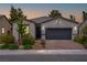 Charming single-story home featuring a two-car garage, brick driveway, and well-manicured landscaping at 4356 E Cactus Canyon Dr, Pahrump, NV 89061
