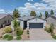 Charming single-story home featuring a two-car garage, brick driveway, and well-manicured landscaping at 4356 E Cactus Canyon Dr, Pahrump, NV 89061