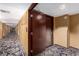 Hallway with patterned carpet and neutral wallpaper leading to a suite entrance at 4381 W Flamingo Rd # 18320, Las Vegas, NV 89103