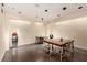 Modern office space featuring tables, chairs, and minimalist decor with dark wood floors at 4381 W Flamingo Rd # 18320, Las Vegas, NV 89103
