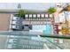 Stunning rooftop pool area featuring private cabanas, lounge chairs, and tables with great overhead view at 4381 W Flamingo Rd # 18320, Las Vegas, NV 89103