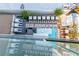 Stunning rooftop pool area featuring private cabanas, lounge chairs, and tables with great overhead view at 4381 W Flamingo Rd # 18320, Las Vegas, NV 89103