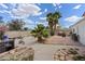 Spacious backyard showcasing a patio, lush greenery, and playful items at 4602 Inland Ct, Las Vegas, NV 89147