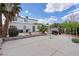 A large backyard with a basketball hoop, a patio, and a spacious play area at 4602 Inland Ct, Las Vegas, NV 89147