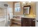 Compact bathroom with tile flooring, vanity with sink, mirror, and toilet, providing functionality and comfort at 4602 Inland Ct, Las Vegas, NV 89147