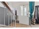 Bright and welcoming foyer with tile flooring and a staircase leading to the upper level of the home at 4602 Inland Ct, Las Vegas, NV 89147