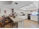 Bright kitchen with tiled countertops, white cabinets, and a breakfast bar at 4602 Inland Ct, Las Vegas, NV 89147