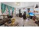 Spacious living room with wood look floors, fireplace, ample seating, and bright natural light from the front windows at 4602 Inland Ct, Las Vegas, NV 89147