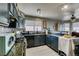 Stylish kitchen with dark cabinets and modern appliances at 4735 Roby Grey Way, North Las Vegas, NV 89081