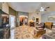 Inviting living room featuring tile flooring and a cozy fireplace at 4735 Roby Grey Way, North Las Vegas, NV 89081