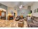 Comfortable living room with plush seating and a warm fireplace at 4735 Roby Grey Way, North Las Vegas, NV 89081