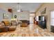 Bright living room with tile floors and a ceiling fan at 4735 Roby Grey Way, North Las Vegas, NV 89081