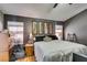 Bedroom with gray walls, and a ceiling fan at 4735 Roby Grey Way, North Las Vegas, NV 89081