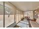 Bright sun room features neutral tones, concrete flooring, and ample natural light at 4735 Roby Grey Way, North Las Vegas, NV 89081