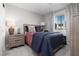 Stylish bedroom with a comfortable bed, coordinated lamps, and a window view that enhances the room's natural light at 494 Mahogany Ridge St, Las Vegas, NV 89138