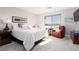 Comfortable bedroom featuring a cozy bed, a sitting area, and soft lighting, creating a relaxing and inviting atmosphere at 494 Mahogany Ridge St, Las Vegas, NV 89138
