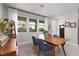 Bright dining room with a wooden table, blue chairs and a view of outside at 494 Mahogany Ridge St, Las Vegas, NV 89138