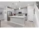 Modern kitchen featuring white cabinetry, stainless steel appliances, and a center island at 494 Mahogany Ridge St, Las Vegas, NV 89138
