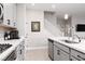 Well-lit kitchen with stainless steel appliances, white countertops and gray cabinetry at 494 Mahogany Ridge St, Las Vegas, NV 89138