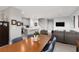 Spacious living area with stairs, open kitchen, and dining table adjacent to comfortable seating at 494 Mahogany Ridge St, Las Vegas, NV 89138