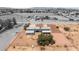 This aerial shot highlights a modern home with solar panels and a large gravel-covered yard at 5085 Raven Ave, Las Vegas, NV 89139