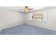 Neutral bedroom featuring a window with shutters, carpeted floor, and ceiling fan at 5085 Raven Ave, Las Vegas, NV 89139
