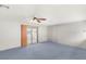 Spacious bedroom features a ceiling fan and sliding glass door to the backyard patio at 5085 Raven Ave, Las Vegas, NV 89139