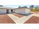Close up view of a well-maintained front yard, two car garage, and entryway at 5085 Raven Ave, Las Vegas, NV 89139