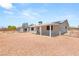 Back exterior view shows the covered patio and ample yard space at 5085 Raven Ave, Las Vegas, NV 89139