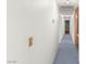 Hallway with carpeted floor and white walls leading to other rooms in the home at 5085 Raven Ave, Las Vegas, NV 89139