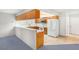 Kitchen shows appliances and counterspace, open to the carpeted living room at 5085 Raven Ave, Las Vegas, NV 89139