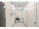 Bright laundry room with washer, dryer, and storage cabinets at 5085 Raven Ave, Las Vegas, NV 89139
