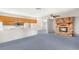 Open concept living room features a brick fireplace and views to the kitchen at 5085 Raven Ave, Las Vegas, NV 89139