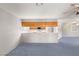 Open living room space features a ceiling fan and flows into the kitchen and dining areas at 5085 Raven Ave, Las Vegas, NV 89139