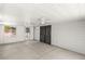 Enclosed sun room features concrete floors, white walls and ceiling fans at 5085 Raven Ave, Las Vegas, NV 89139