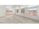 Enclosed sun room features concrete floors, white walls, and multiple windows at 5085 Raven Ave, Las Vegas, NV 89139