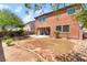 Expansive backyard with a concrete patio, brick fencing, and lots of space for outdoor activities at 5852 Clear Haven Ln, North Las Vegas, NV 89081