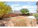 Wide view of the spacious backyard and its surrounding brick fence at 5852 Clear Haven Ln, North Las Vegas, NV 89081