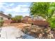 Large backyard featuring a concrete patio area and a brick fence, perfect for outdoor living at 5852 Clear Haven Ln, North Las Vegas, NV 89081