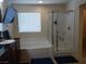 Bright bathroom featuring a soaking tub, a separate glass-enclosed shower, and a granite-topped vanity at 5852 Clear Haven Ln, North Las Vegas, NV 89081