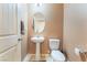 Powder room featuring pedestal sink and neutral decor at 5852 Clear Haven Ln, North Las Vegas, NV 89081