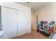 Cozy bedroom featuring a closet with sliding doors and functional organizers for storage and decor at 5852 Clear Haven Ln, North Las Vegas, NV 89081