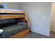 Bedroom showcasing a wooden bunk bed, offering a comfortable and space-saving sleeping arrangement at 5852 Clear Haven Ln, North Las Vegas, NV 89081