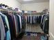 Spacious walk-in closet with ample hanging storage for clothing and shoes at 5852 Clear Haven Ln, North Las Vegas, NV 89081