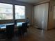 Dining area with tile floors, a dining table, and large windows at 5852 Clear Haven Ln, North Las Vegas, NV 89081