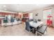 Open dining area with kitchen island seating and a modern table for entertaining at 5852 Clear Haven Ln, North Las Vegas, NV 89081