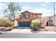 Two-story home with desert landscaping, a two-car garage, and an inviting front entrance for potential buyers at 5852 Clear Haven Ln, North Las Vegas, NV 89081
