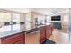 Open kitchen featuring stainless steel appliances, granite counters and an island with a sink at 5852 Clear Haven Ln, North Las Vegas, NV 89081