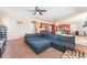 Spacious living area leading into the kitchen, designed for relaxation, complemented by natural lighting at 5852 Clear Haven Ln, North Las Vegas, NV 89081